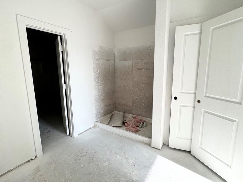 Full bath with concrete floors and a stall shower Full bath with concrete floors and a stall shower