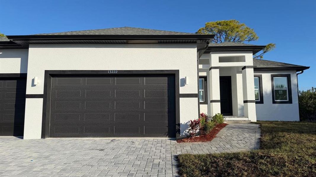 Front exterior of a new home in , Port Charlotte, FL, highlighting curb appeal (Image 21).