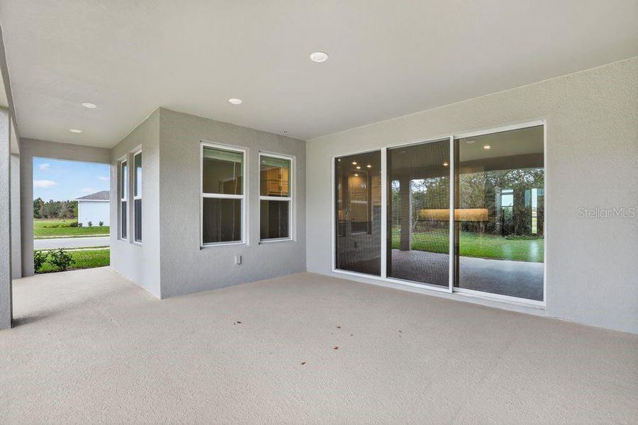 Exterior details and patio area of a home in Ardisia Park, New Smyrna Beach (Image 27).