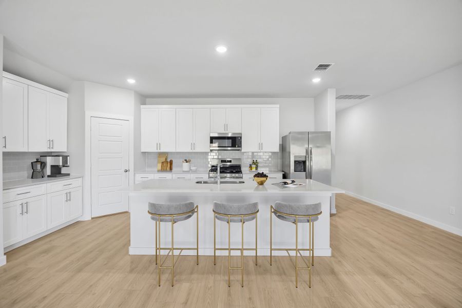 Kitchen in the Heisman home plan by Trophy Signature Homes – REPRESENTATIVE PHOTO Kitchen in the Heisman home plan by Trophy Signature Homes – REPRESENTATIVE PHOTO