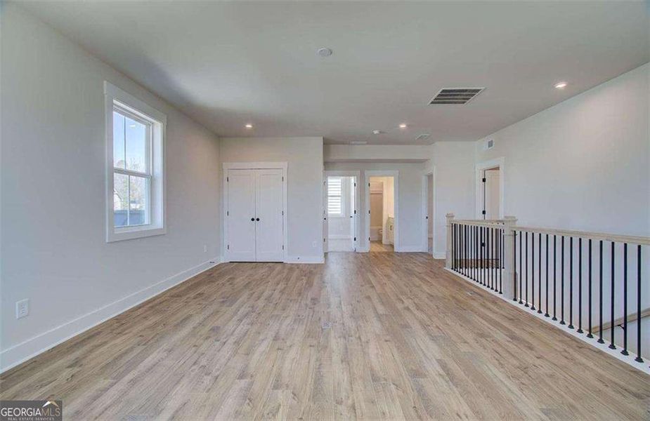 Spacious, unfurnished interior of a new home in The Paddocks at Doc Hughes, Buford (Image 27).