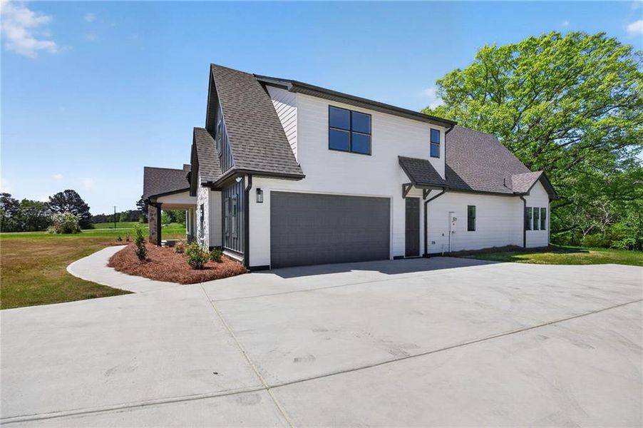 Front exterior of a new home in The Meadows at Lake Circle, Buchanan, GA, highlighting curb appeal (Image 27).