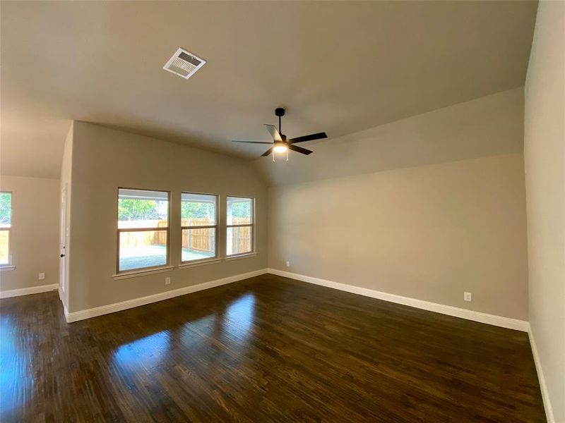 Family room with wall of windows, ceiling fan, and rich scraped hardwoods Family room with wall of windows, ceiling fan, and rich scraped hardwoods