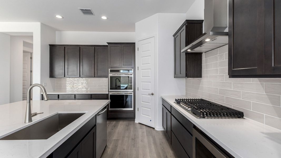 Representative furnished interior of a home built from the Granada by DRB Homes in Windrose, Waddell (Image 22).