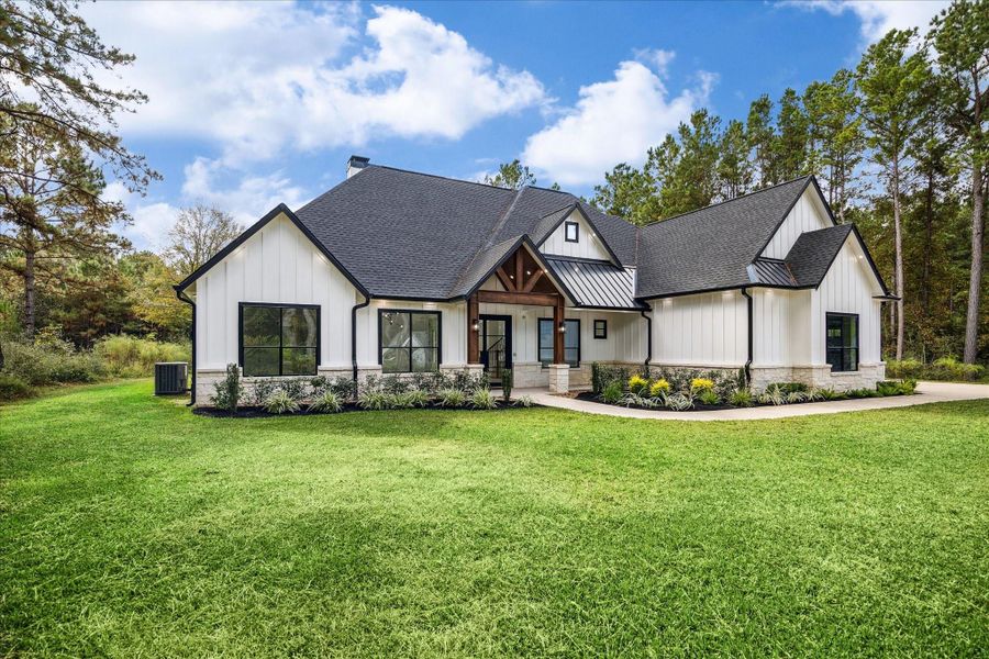 Front exterior of a new home in , Waller, TX, highlighting curb appeal (Image 23).