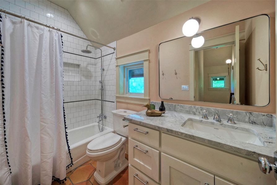 Lovely bathroom #2 features Saltillo tile and quartz countertop