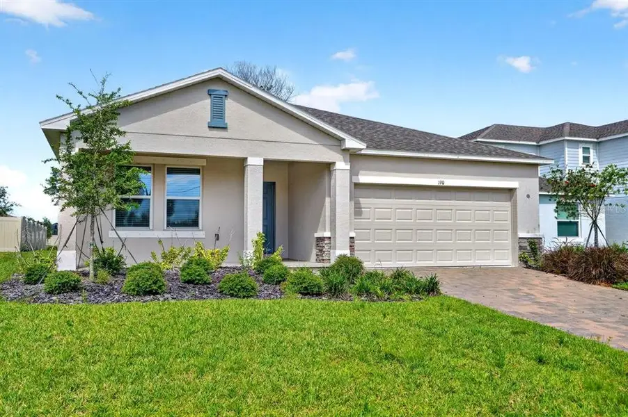 Front exterior of a new home in Riverfront, Edgewater, FL, highlighting curb appeal (Image 2). Front exterior of a new home in Riverfront, Edgewater, FL, highlighting curb appeal (Image 2).