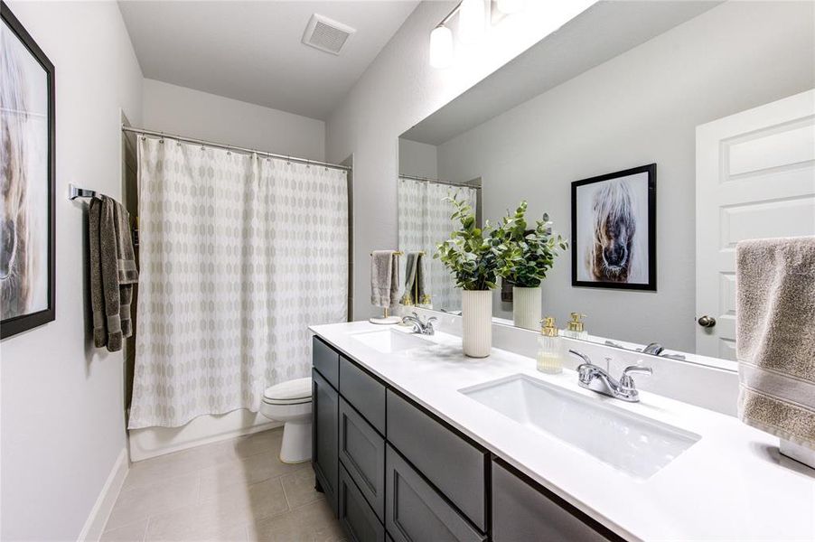 The third full bathroom in the home is located on the 2nd floor.