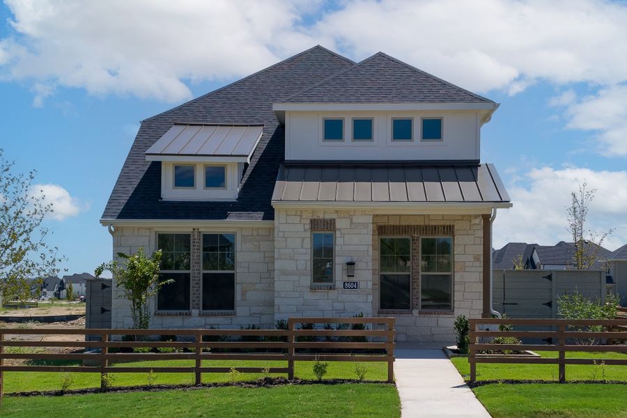 Front exterior of a new home in Treeline, Justin, TX, highlighting curb appeal (Image 1). Front exterior of a new home in Treeline, Justin, TX, highlighting curb appeal (Image 1).