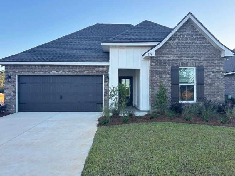 Front exterior of a new home in Natureview, Freeport, FL, highlighting curb appeal (Image 1). Front exterior of a new home in Natureview, Freeport, FL, highlighting curb appeal (Image 1).