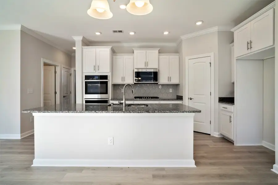 Representative furnished interior of a home built from the The Jasmine by Chesapeake Homes in Coastal Club of the Carolinas, Calabash (Image 5).