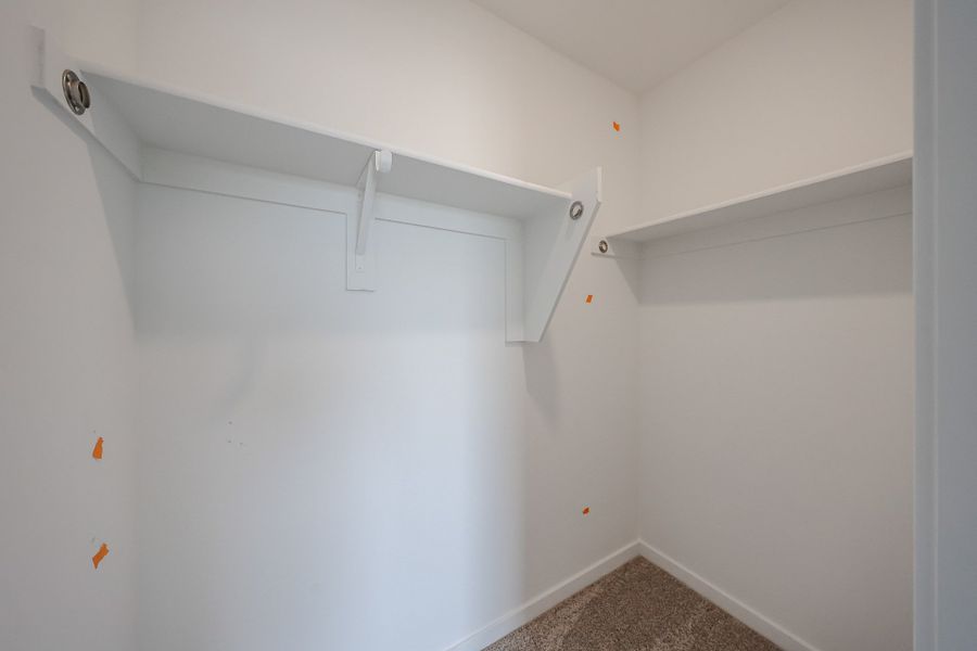 A white wall with a vent. A white wall with a vent.