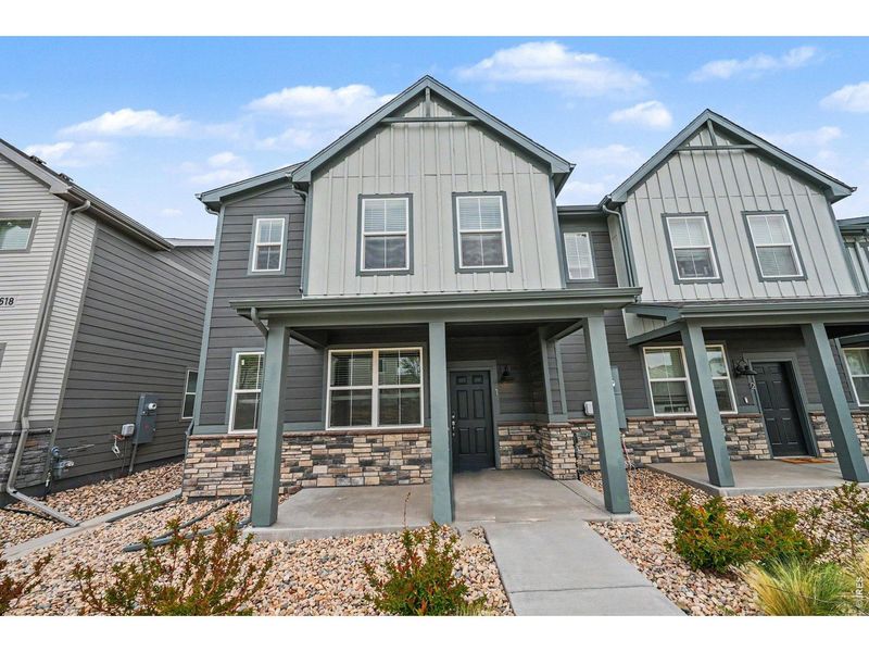 Front exterior of a new home in Poudre Heights: The Meadow Collection, Windsor, CO, highlighting curb appeal (Image 26). Front exterior of a new home in Poudre Heights: The Meadow Collection, Windsor, CO, highlighting curb appeal (Image 26).