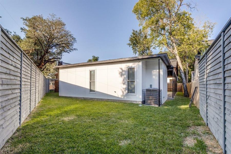 Back of house featuring a yard