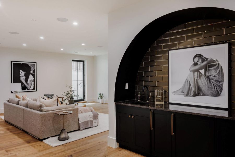 Lower level entertainer’s haven with a full wet bar, integrated sound system, and direct access to the outdoor terrace. Lower level entertainer’s haven with a full wet bar, integrated sound system, and direct access to the outdoor terrace.