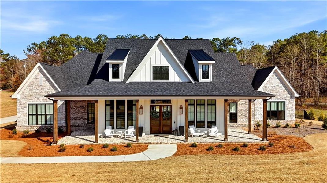 Front exterior of a new home in , Woodstock, GA, highlighting curb appeal (Image 29). Front exterior of a new home in , Woodstock, GA, highlighting curb appeal (Image 29).