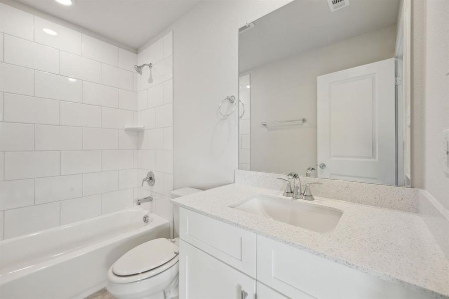 Full bath with shower / bathtub combination, vanity, and toilet