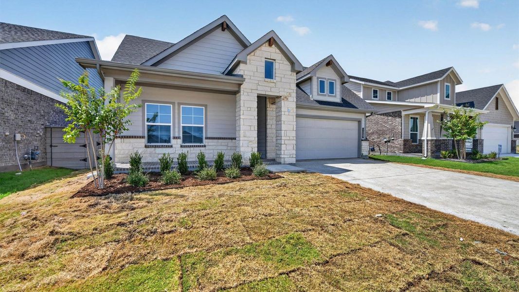 Representative exterior photo of a completed home built from the Desert Willow by D.R. Horton in Treeline, Justin, TX (Image 21).