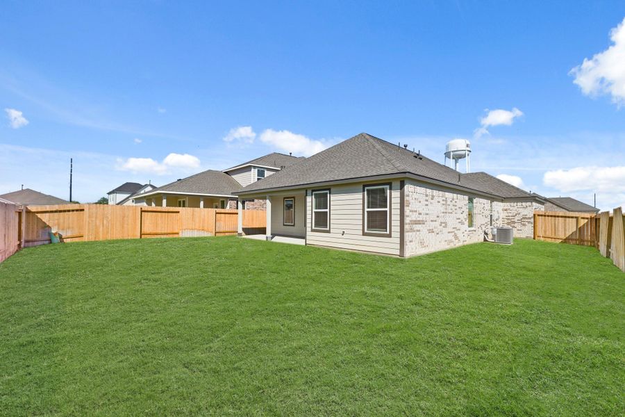 Exterior details and patio area of a home in Beacon Hill, Waller (Image 13). Exterior details and patio area of a home in Beacon Hill, Waller (Image 13).