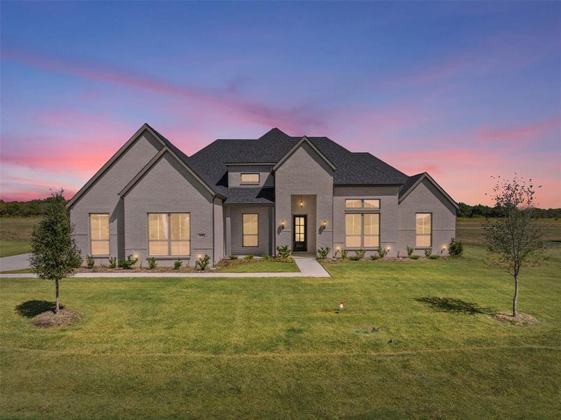 Front exterior of a new home in Waterfall Ranch - 1 Acre Lots, Waxahachie, TX, highlighting curb appeal (Image 2). Front exterior of a new home in Waterfall Ranch - 1 Acre Lots, Waxahachie, TX, highlighting curb appeal (Image 2).