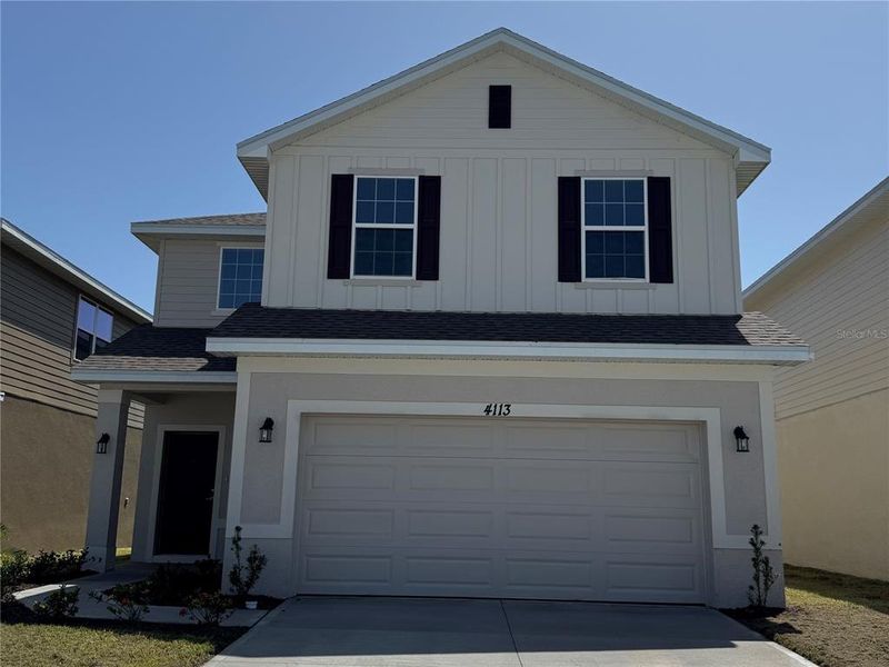 Front exterior of a new home in Harmony Central, Harmony, FL, highlighting curb appeal (Image 16). Front exterior of a new home in Harmony Central, Harmony, FL, highlighting curb appeal (Image 16).