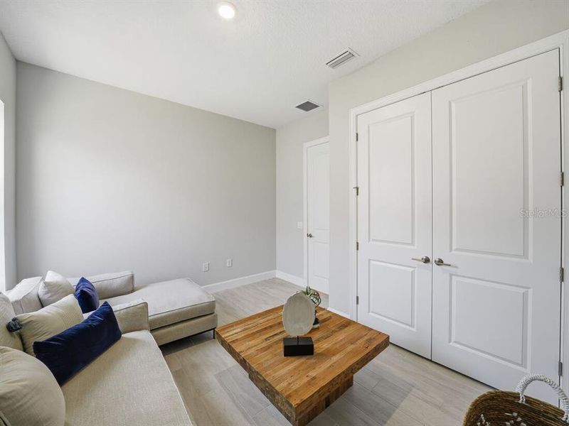 Furnished interior view inside a new home in Esplanade at Westview, Kissimmee (Image 11).