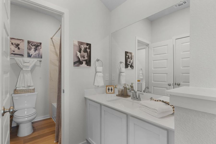 Representative furnished interior of a home built from the Wilshire by Chesmar Homes in Stream Waters, Buda (Image 16).
