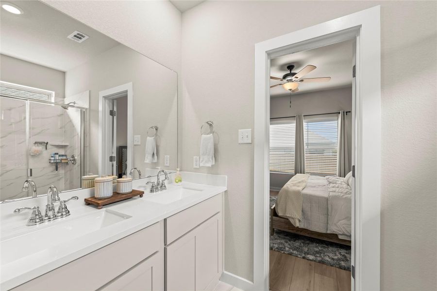 Double vanity and a tiled shower create a refreshing spa-like retreat. Double vanity and a tiled shower create a refreshing spa-like retreat.
