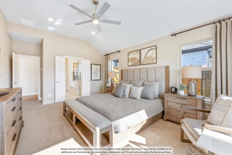 Master bedroom with vaulted ceiling, ceiling fan, king bed, and wood furniture on neutral carpet Master bedroom with vaulted ceiling, ceiling fan, king bed, and wood furniture on neutral carpet