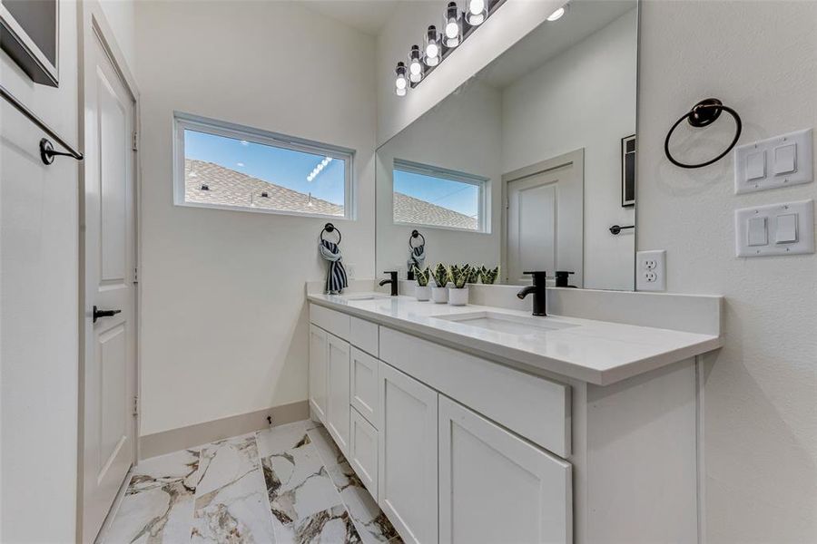 Primary bathroom with vanity and dual sink