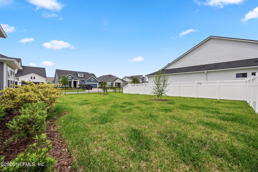 Exterior details and patio area of a home in Oak Grove at SilverLeaf 60’, St. Augustine (Image 4).