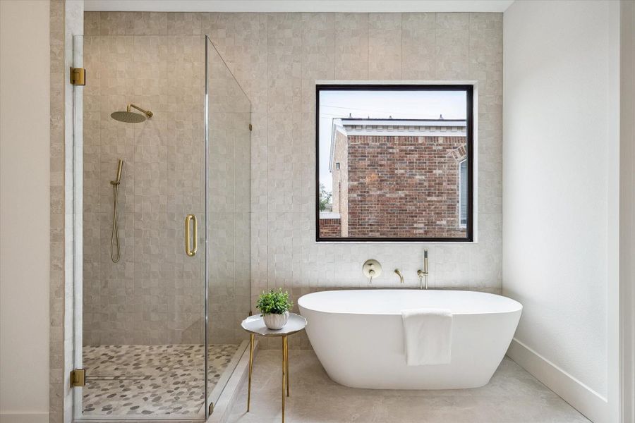 Primary bath features walk-in shower with two shower heads and a free standing tub. Primary bath features walk-in shower with two shower heads and a free standing tub.