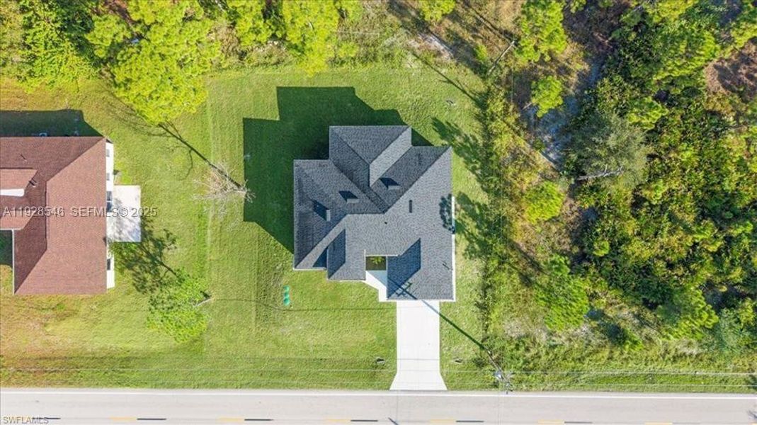 Front exterior of a new home in , Lehigh Acres, FL, highlighting curb appeal (Image 23).
