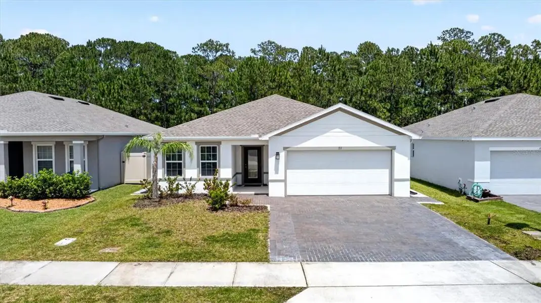 Front exterior of a new home in , Daytona Beach, FL, highlighting curb appeal (Image 1). Front exterior of a new home in , Daytona Beach, FL, highlighting curb appeal (Image 1).