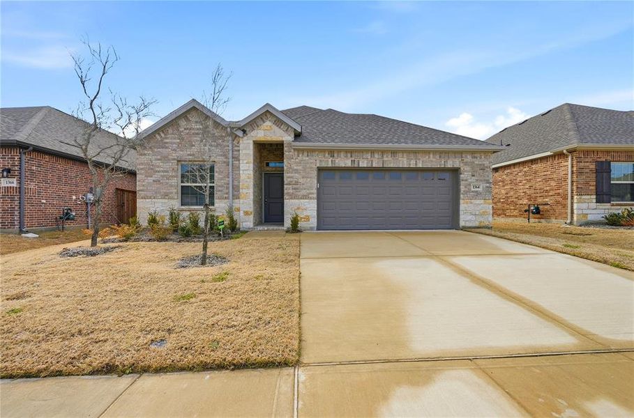 Front exterior of a new home in , Forney, TX, highlighting curb appeal (Image 2). Front exterior of a new home in , Forney, TX, highlighting curb appeal (Image 2).