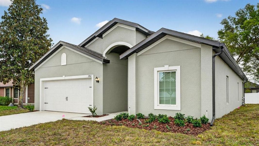 Front exterior of a new home in , Deltona, FL, highlighting curb appeal (Image 19). Front exterior of a new home in , Deltona, FL, highlighting curb appeal (Image 19).
