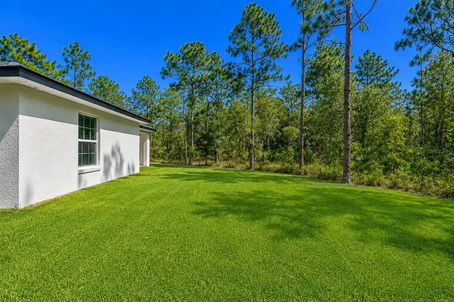 Exterior details and patio area of a home in , Brooksville (Image 31). Exterior details and patio area of a home in , Brooksville (Image 31).