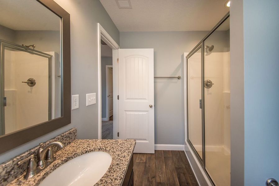 Representative furnished interior of a home built from the Jackson by Enchanted Homes in Lonesome Dove, San Antonio (Image 28).