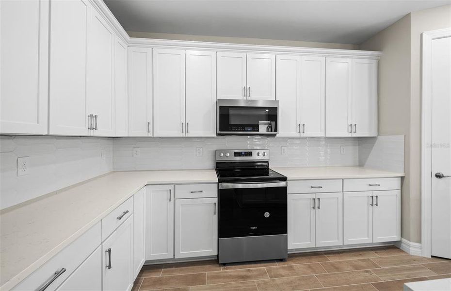 Furnished interior view inside a new home in Cedar Grove at The Woodlands, North Port (Image 7).