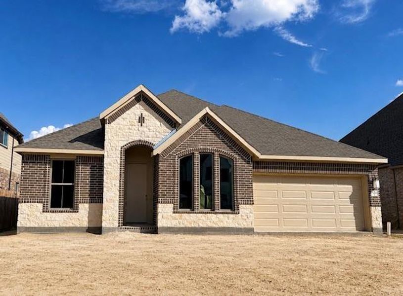 Front exterior of a new home in , Conroe, TX, highlighting curb appeal (Image 2). Front exterior of a new home in , Conroe, TX, highlighting curb appeal (Image 2).