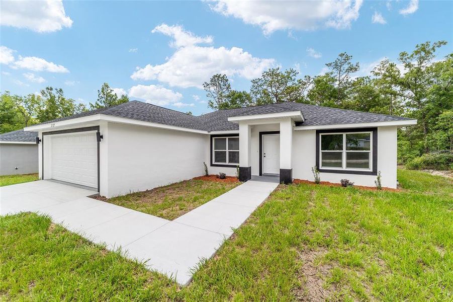 Front exterior of a new home in , Dunnellon, FL, highlighting curb appeal (Image 19). Front exterior of a new home in , Dunnellon, FL, highlighting curb appeal (Image 19).