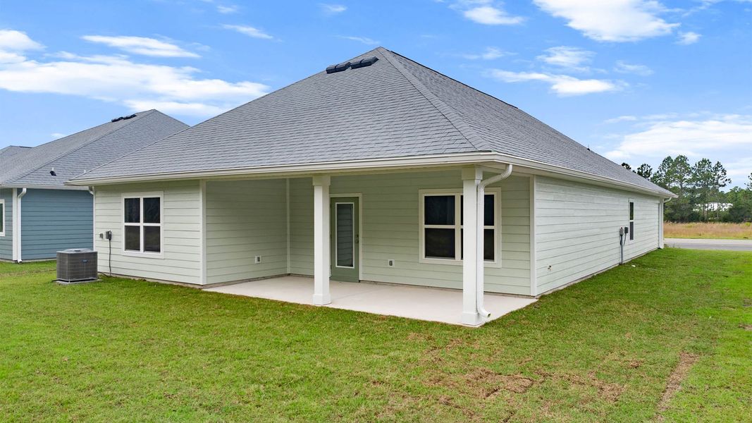 Exterior details and patio area of a home in Buffer Farms, Port Saint Joe (Image 2).
