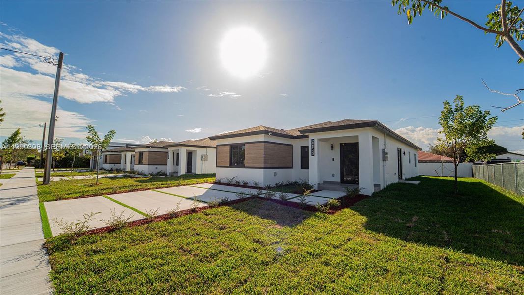 Front exterior of a new home in , Miami, FL, highlighting curb appeal (Image 27). Front exterior of a new home in , Miami, FL, highlighting curb appeal (Image 27).