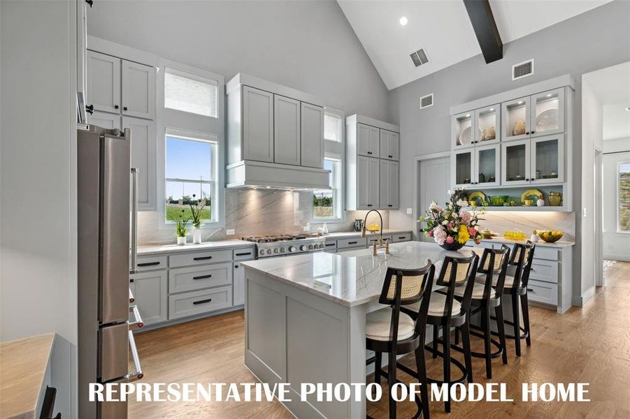 Dream kitchens that all of the chefs in the family will love are plentiful in our homes in Windsong Ranch!  REPRESENTATIVE PHOTO OF MODEL HOME