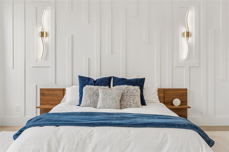 Striking floor to ceiling wood accent wall with sconces Striking floor to ceiling wood accent wall with sconces
