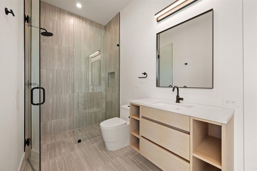 Modern ensuite bath with walk-in shower. Modern ensuite bath with walk-in shower.