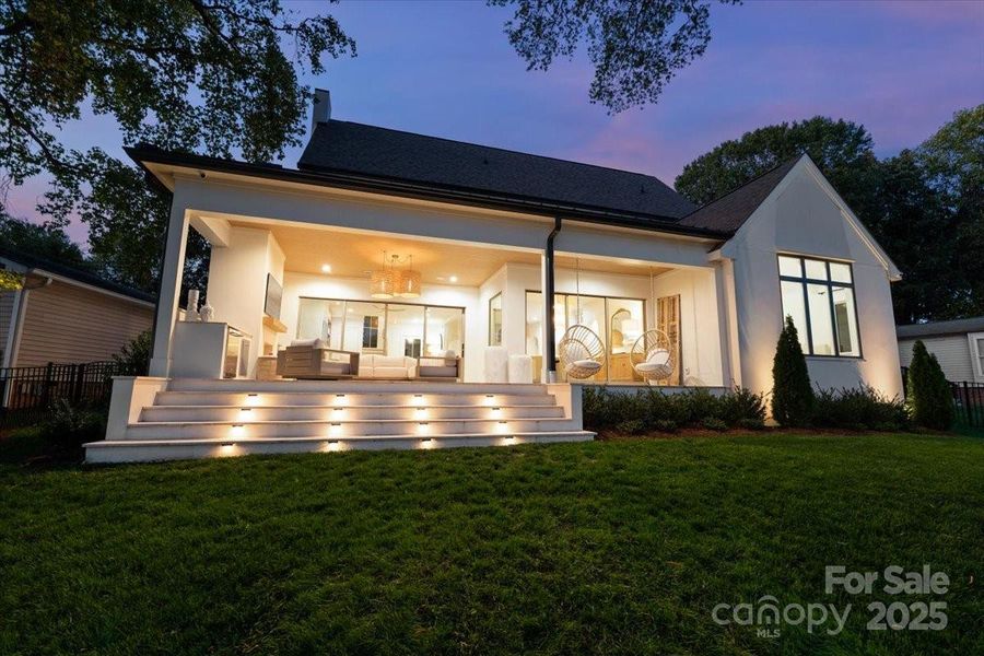 Enjoying entertaining right into the evening with additional outdoor lighting and a fenced backyard. Enjoying entertaining right into the evening with additional outdoor lighting and a fenced backyard.