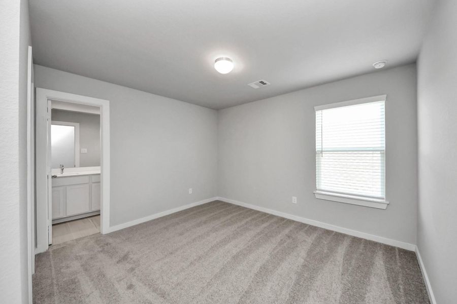 Generously sized secondary bedrooms featuring spacious closets, soft and inviting carpeting underfoot, large windows allowing plenty of natural light, and the added touch of privacy blinds for your personal retreat. Sample photo of completed home with similar floor plan. Actual colors and selections may vary. Generously sized secondary bedrooms featuring spacious closets, soft and inviting carpeting underfoot, large windows allowing plenty of natural light, and the added touch of privacy blinds for your personal retreat. Sample photo of completed home with similar floor plan. Actual colors and selections may vary.