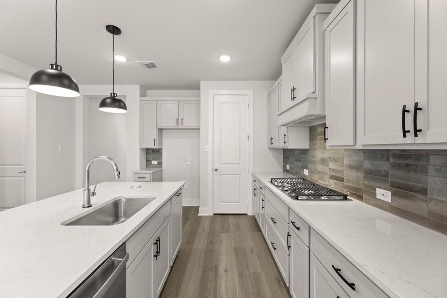 Representative furnished interior of a home built from the Willow by Tri Pointe Homes in Treeline, Justin (Image 4).