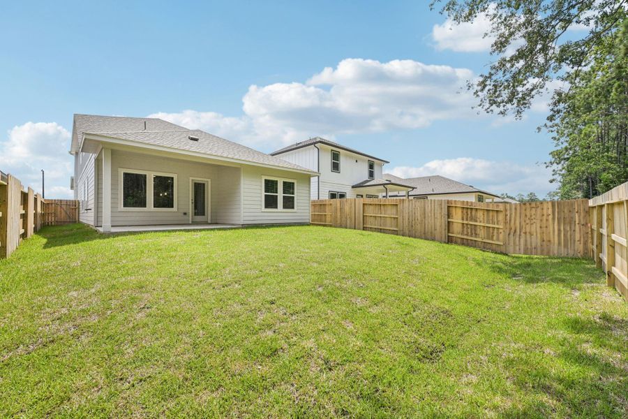 Front exterior of a new home in Landing Meadows - Traditional Series, New Caney, TX, highlighting curb appeal (Image 21).